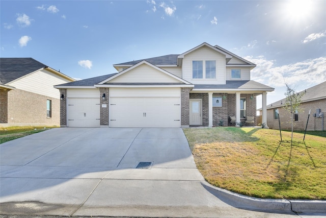 view of front of house featuring a front yard and a garage