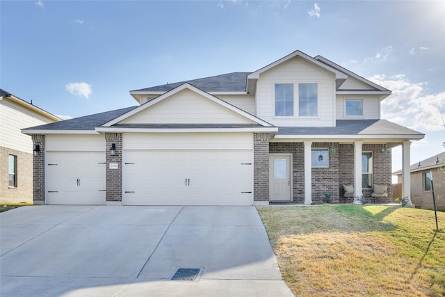 2816 Brosnan Rd, Waco, TX 76655 - view of front of house featuring a garage, brick siding, a front lawn, driveway, and roof with shingles