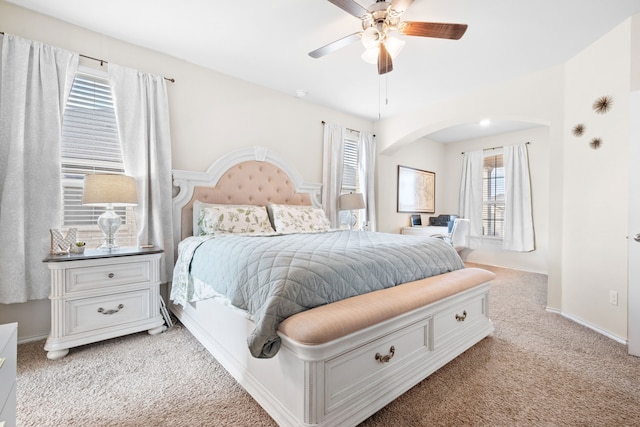 bedroom with ceiling fan and light colored carpet