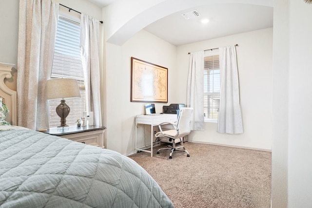 2816 Brosnan Rd, Waco, TX 76655 - carpeted bedroom featuring arched walkways and an office area