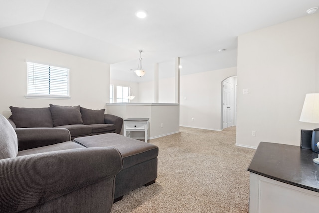 2816 Brosnan Rd, Waco, TX 76655 - living room with arched walkways, light carpet, and baseboards