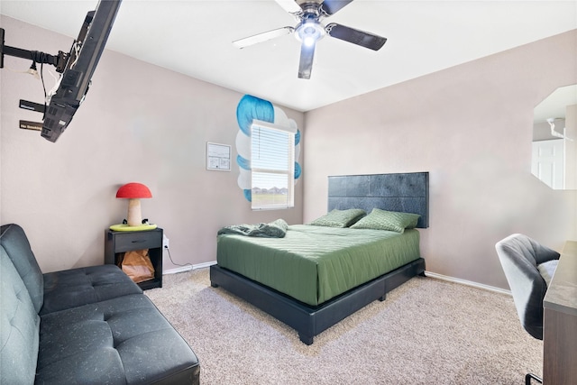 bedroom featuring light colored carpet and ceiling fan