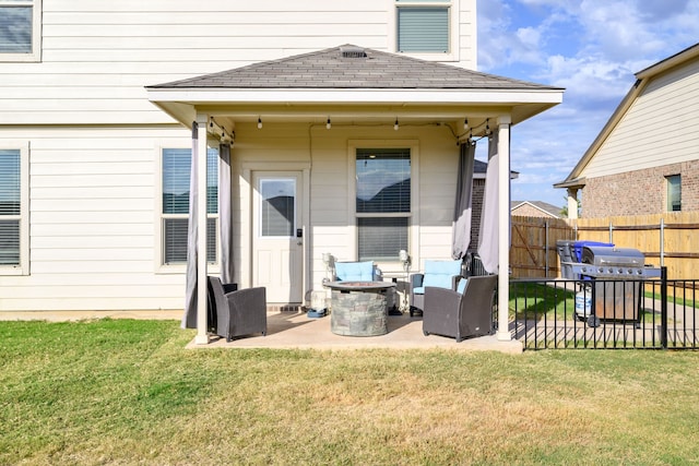 rear view of property featuring a patio area and a lawn