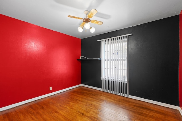 empty room featuring hardwood / wood-style flooring and ceiling fan