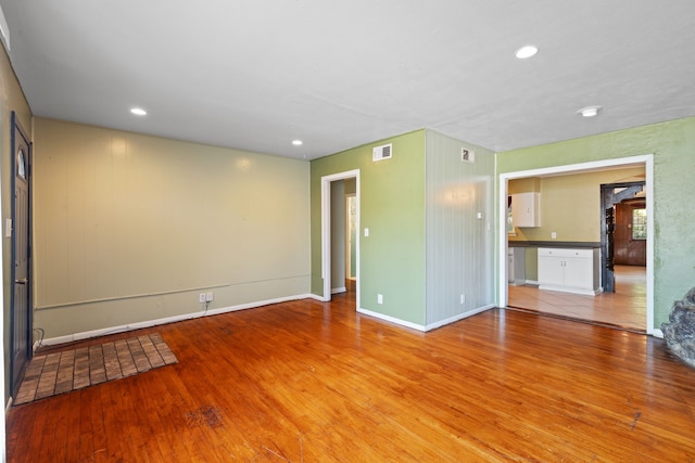 unfurnished room with light hardwood / wood-style flooring