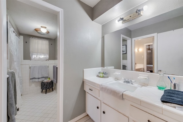 bathroom with vanity and tile patterned floors