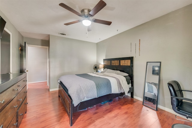 bedroom with ceiling fan and light hardwood / wood-style flooring