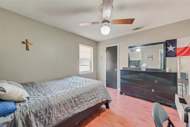 bedroom featuring hardwood / wood-style floors and ceiling fan