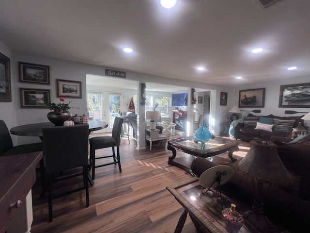 living room with french doors and hardwood / wood-style flooring