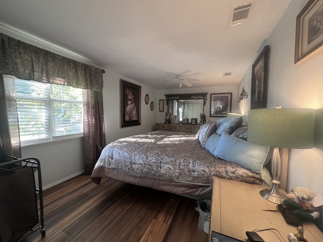 bedroom featuring hardwood / wood-style flooring and ceiling fan