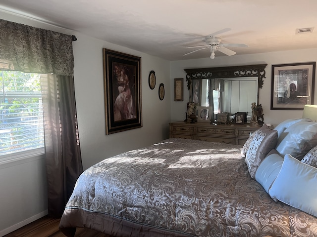 bedroom featuring hardwood / wood-style flooring and ceiling fan