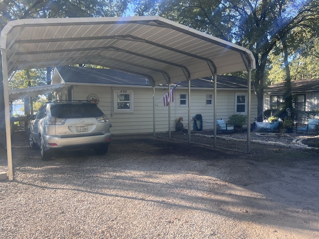 view of vehicle parking featuring a carport