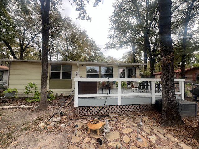 rear view of house with a deck