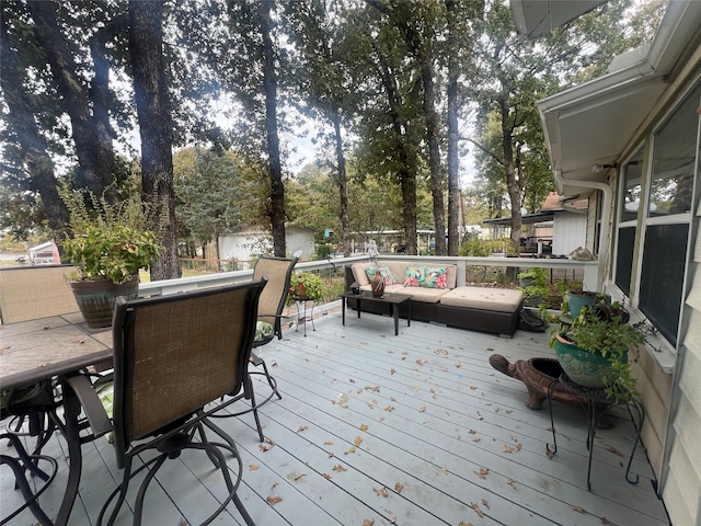 wooden terrace featuring an outdoor hangout area