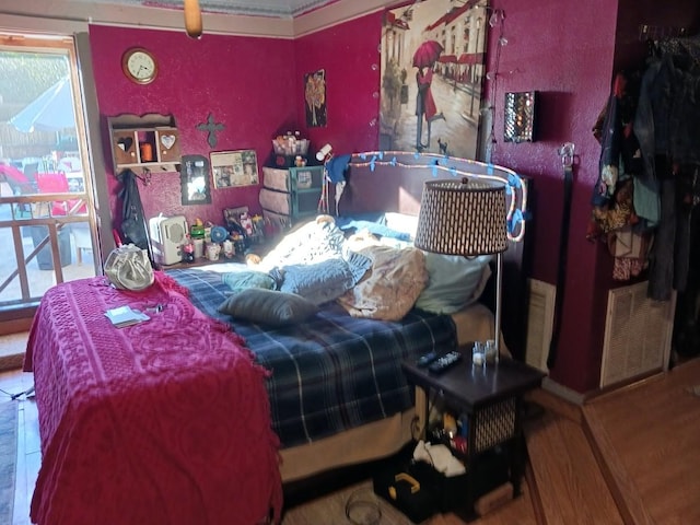 bedroom featuring wood-type flooring