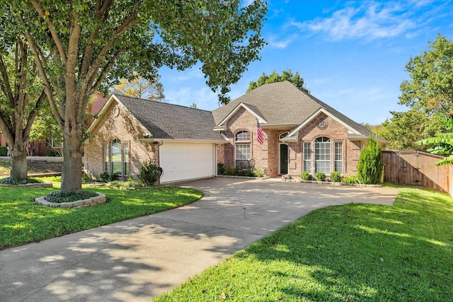 view of front facade with a garage and a front lawn