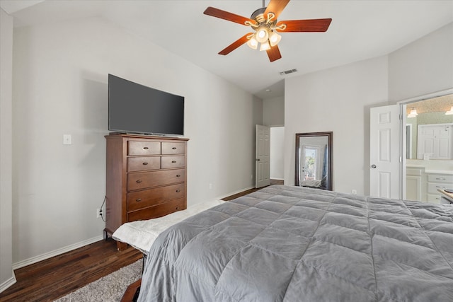 bedroom featuring hardwood / wood-style floors, ensuite bathroom, ceiling fan, and vaulted ceiling