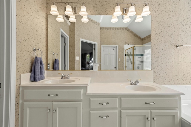 bathroom with plus walk in shower, lofted ceiling, and vanity