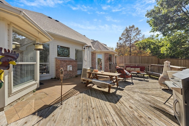 wooden deck with outdoor lounge area