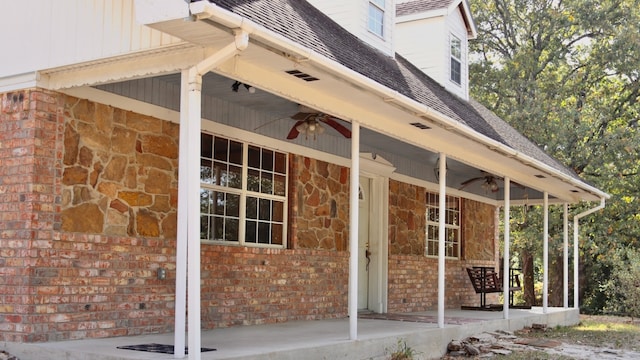 entrance to property with ceiling fan and a porch