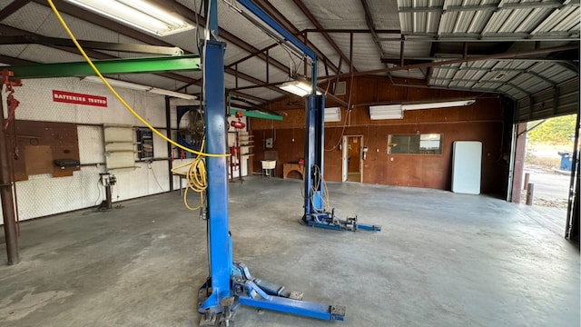 garage featuring wooden walls