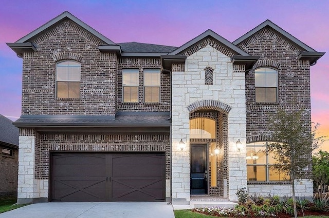 french country style house with a garage