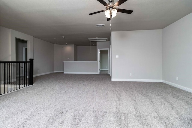 unfurnished living room featuring ceiling fan and carpet flooring