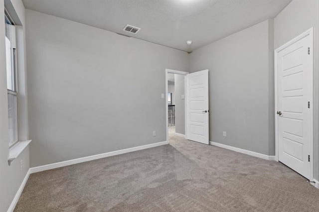 unfurnished bedroom with carpet flooring