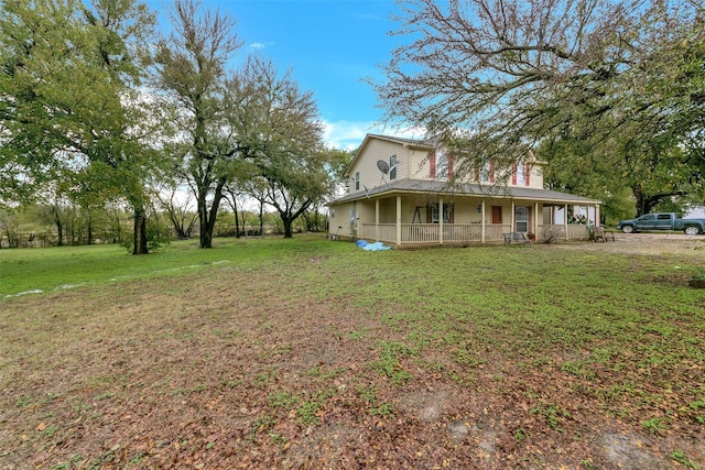 view of front of house featuring covered porch and a front yard