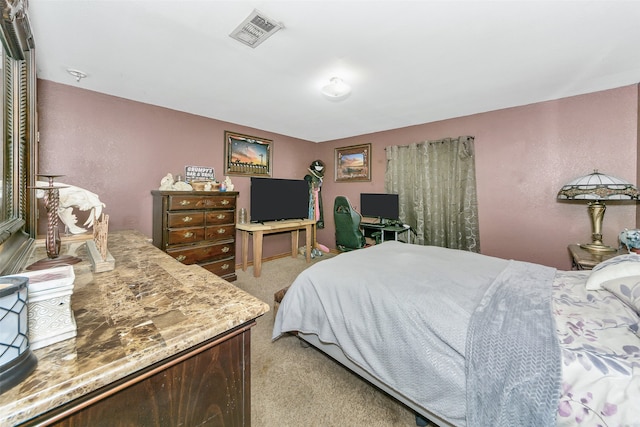 bedroom featuring light carpet