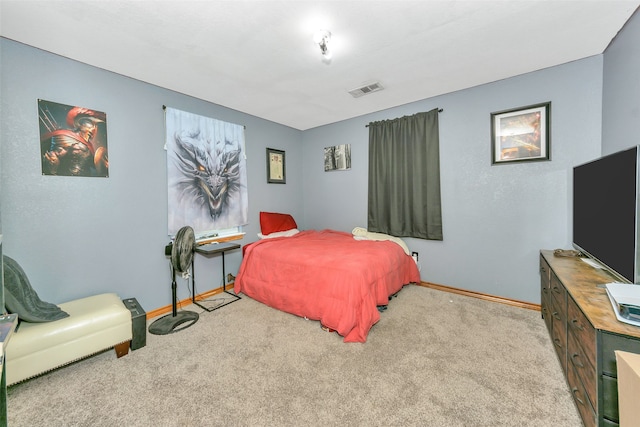 bedroom with light colored carpet