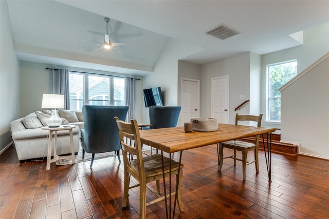 dining room with lofted ceiling, ceiling fan, and dark hardwood / wood-style flooring