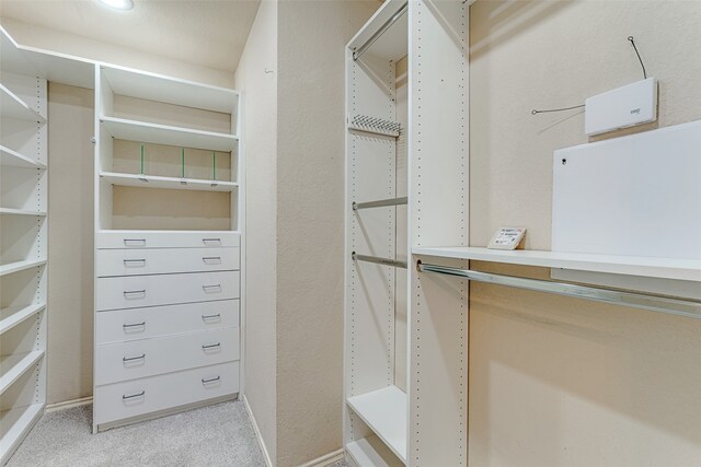 bedroom with vaulted ceiling, ceiling fan, and carpet floors