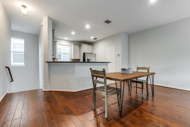 dining area with dark wood-type flooring