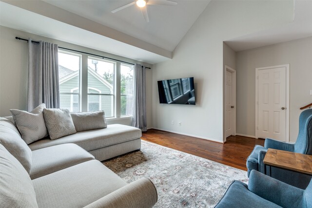 living room with ceiling fan, lofted ceiling, and dark hardwood / wood-style floors