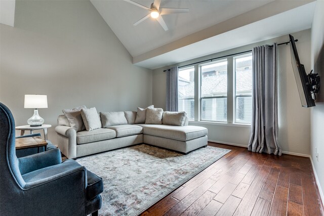 living room featuring dark hardwood / wood-style flooring, vaulted ceiling, and ceiling fan