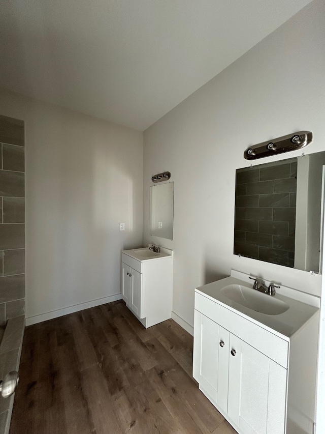 bathroom with hardwood / wood-style floors and vanity