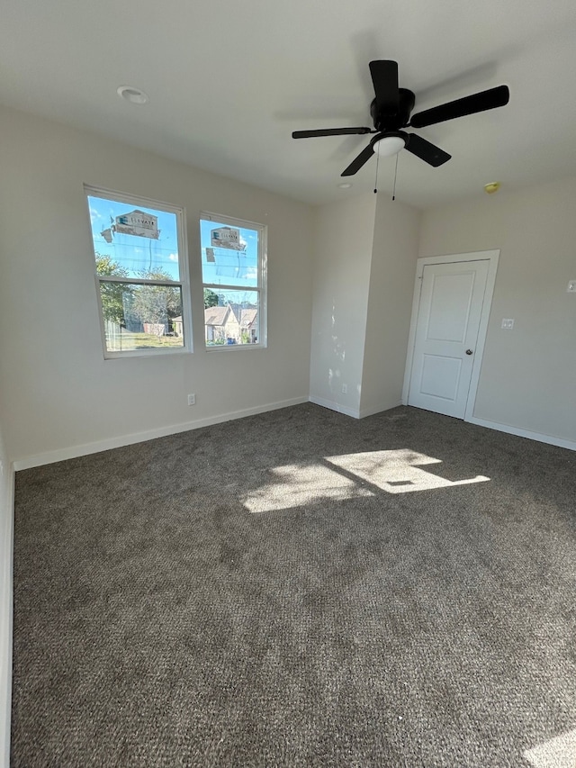 carpeted empty room with ceiling fan