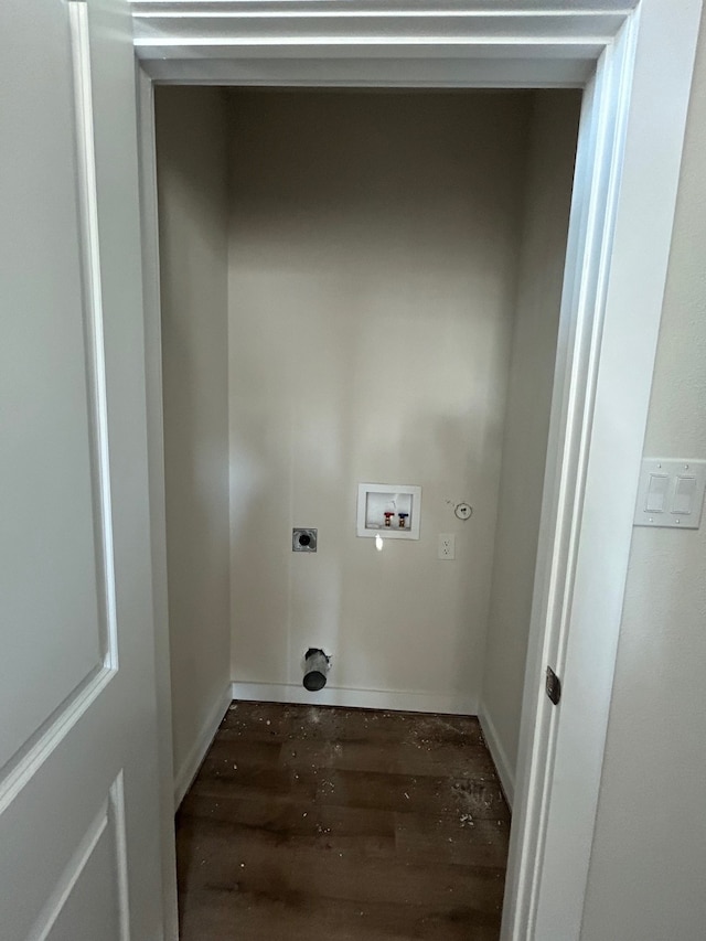 washroom with dark hardwood / wood-style flooring, hookup for a washing machine, electric dryer hookup, and hookup for a gas dryer