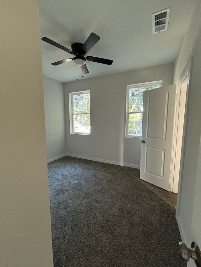 carpeted empty room with ceiling fan