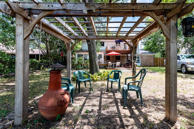 view of patio with a pergola and a storage shed