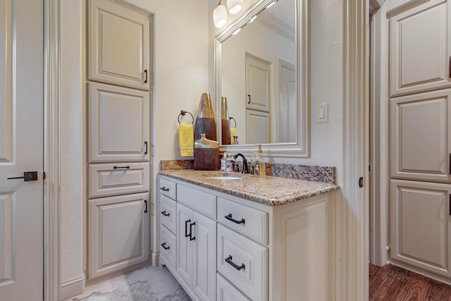 bathroom with vanity and hardwood / wood-style flooring