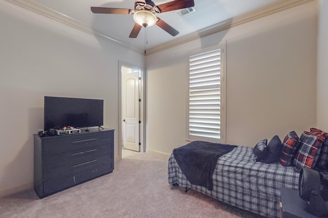 bedroom with light colored carpet, ceiling fan, and crown molding