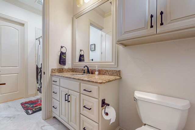 bathroom with toilet, vanity, ornamental molding, and curtained shower