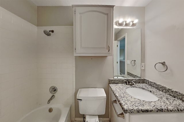 full bathroom with vanity, toilet, and tiled shower / bath combo