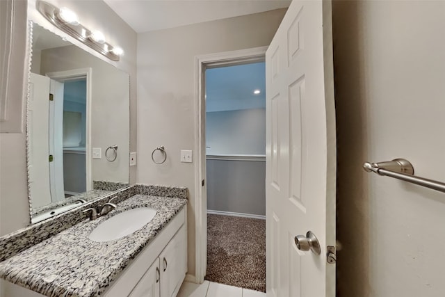 bathroom with tile patterned flooring and vanity