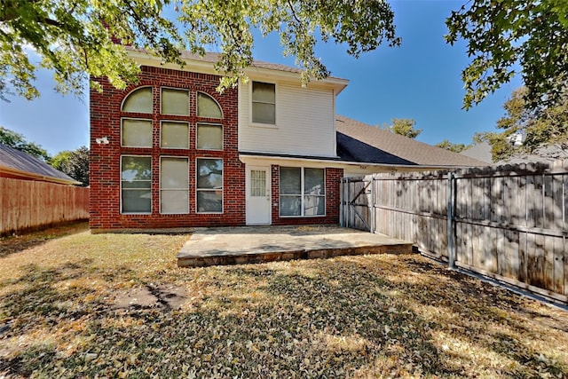 back of property featuring a patio area