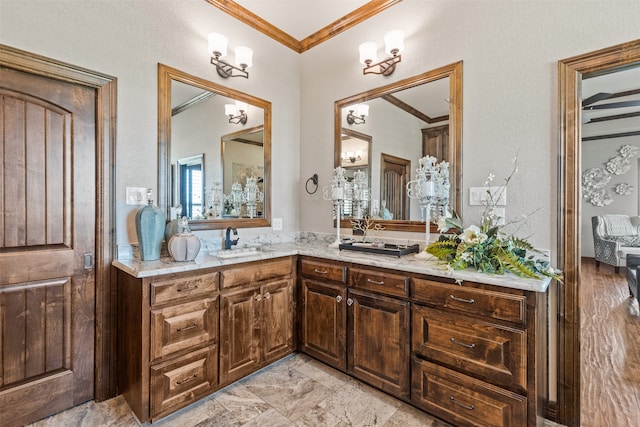 bathroom with vanity and crown molding