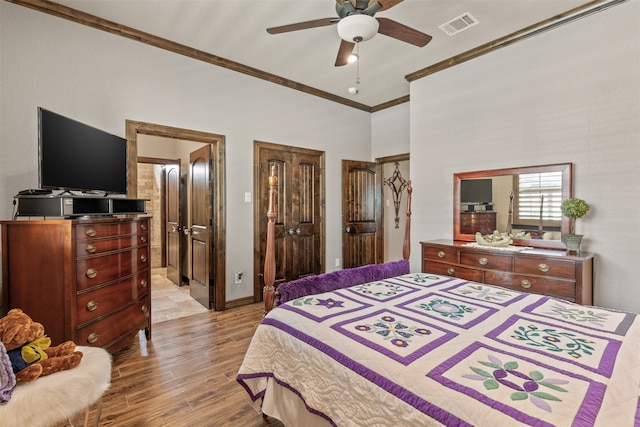 bedroom with ornamental molding, light hardwood / wood-style flooring, and ceiling fan