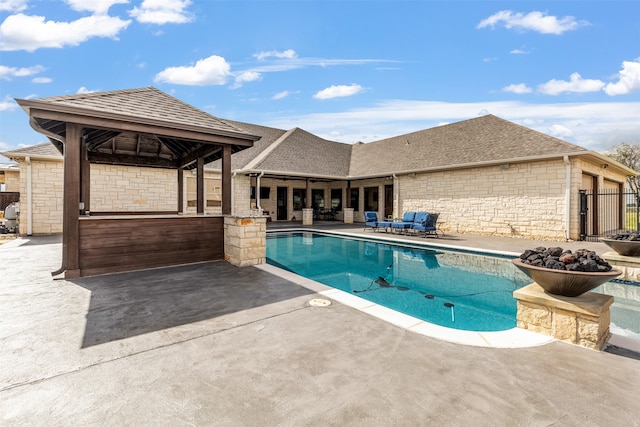 view of pool featuring a patio and a gazebo